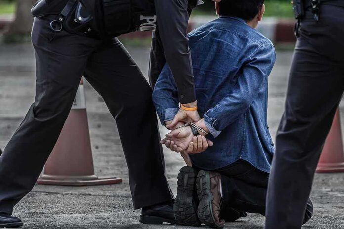 659470504 featured image Man arrested and kneeling