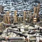 Room filled with various firearms and ammunition belts