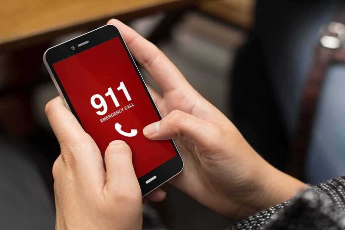 327355202 featured image Person holding smartphone with 911 emergency call screen
