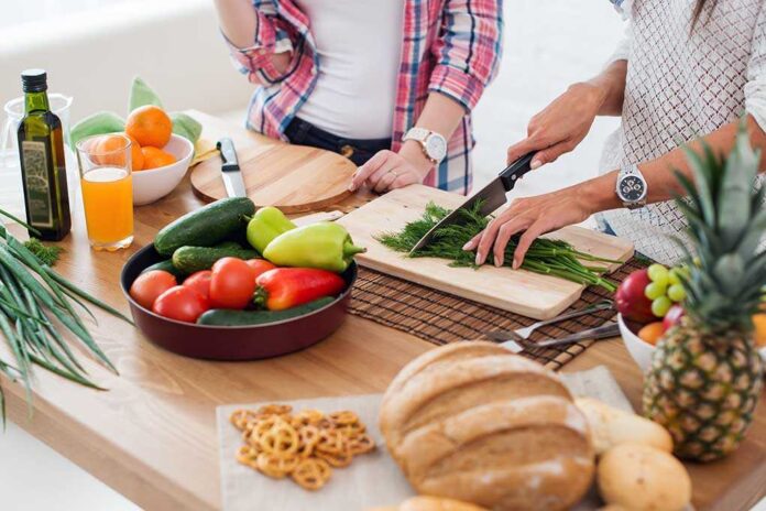 349133213 featured image People preparing fresh vegetables in kitchen