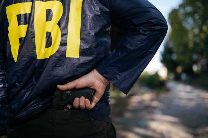 624106589 featured image FBI agent holding a gun behind the back