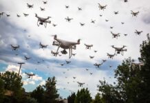 Many drones flying in a cloudy sky