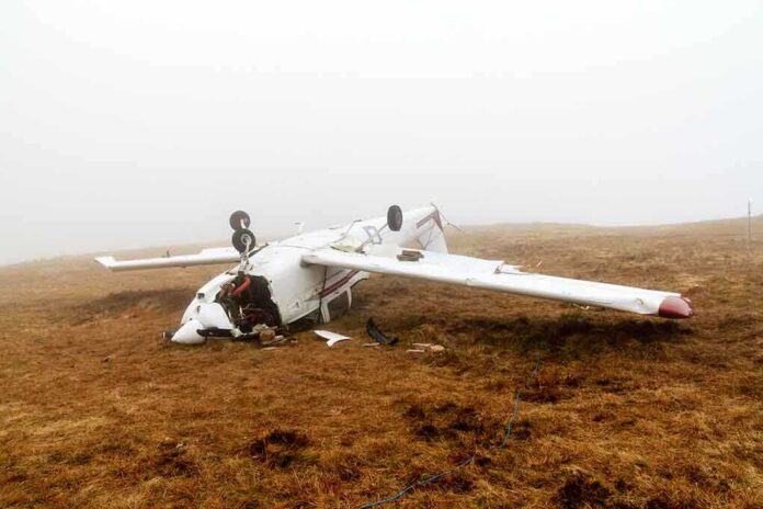 128891288 featured image Overturned crashed airplane on grassy field