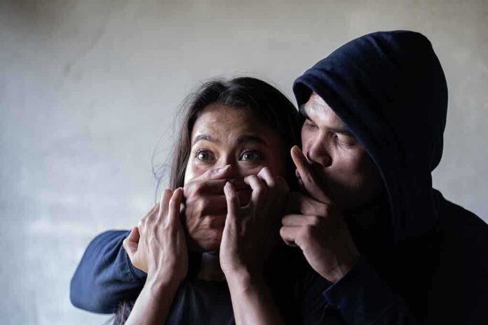 1381990856 featured image Man holding womans mouth gesturing silence