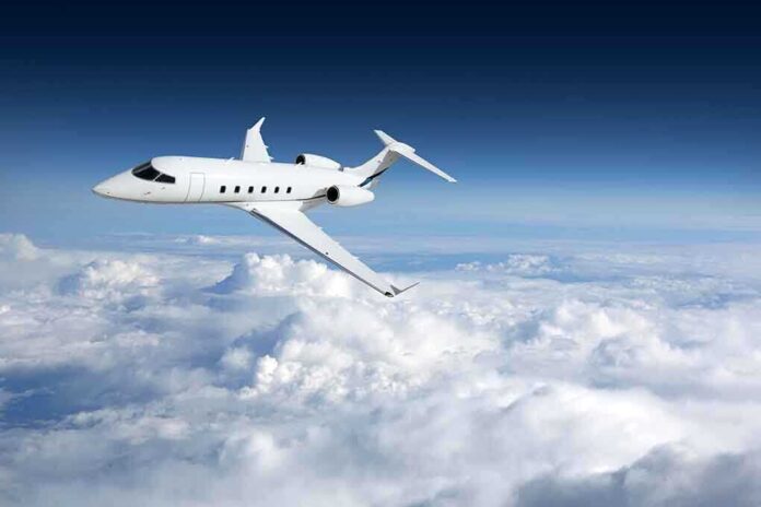 758054764 featured image Private jet flying above the clouds