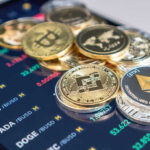 Cryptocurrency coins on a trading screen background