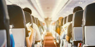 Passengers seated inside an airplane cabin