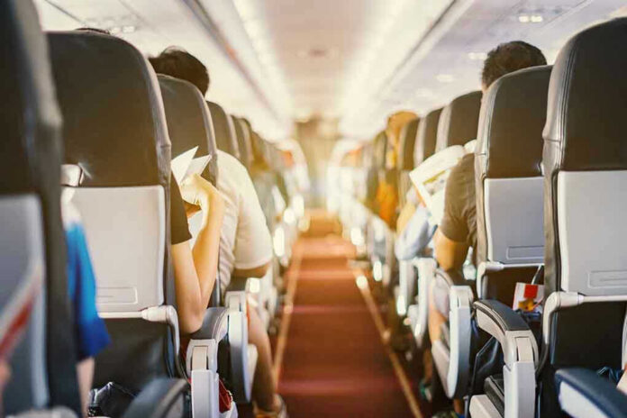 Passengers seated inside an airplane cabin