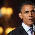 Obama’s PUBLICLY Endorsed Trump – Nobody Expected This! A man in a suit speaking into a microphone with a serious expression