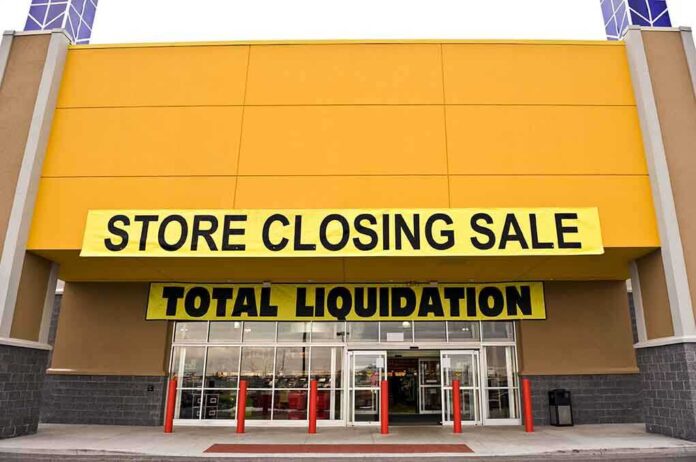 shutterstock_242256169.jpg Exterior of a store with a large sign announcing a closing sale and total liquidation