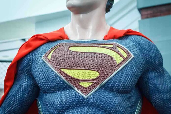 shutterstock_206908987.jpg Close-up of a Superman statue wearing a blue costume and red cape