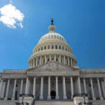Ohio Showdown: ICE Enforcer Challenges Congress Veteran U.S. Capitol building against a clear blue sky.