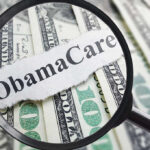 Obamacare Subsidies Cut: Fiscal Reality Hits Magnifying glass over Obamacare text and money