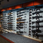 Massive Crime Fall: Hidden Truth Behind Anti-Gun Agenda Wall-mounted guns displayed in a store.