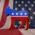 Democrats Accused of Immigration Hypocrisy A donkey symbol representing the Democratic Party in front of an American flag background