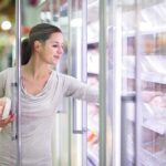 Retail Surveillance Escalates: Wegmans in Hot Water A woman shopping in the frozen food aisle of a supermarket