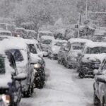 Brutal Cold CRIPPLES Vehicles—Critical Mistake Revealed Traffic jam with cars covered in heavy snow during a snowstorm