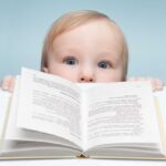 Trump’s Vaccine Order Shocks Health Experts A curious baby peeking over an open book