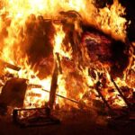 Massive Lawsuits Target City Over Fire Failures A large fire engulfing debris at night