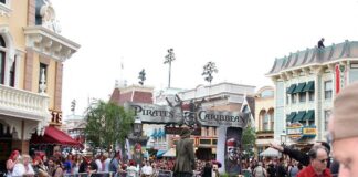 Crowd gathered at a Disney theme park for a Pirates of the Caribbean event