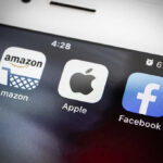 Apple’s Age Rule: Privacy Balancing Act Amazon Apple Facebook apps on smartphone screen