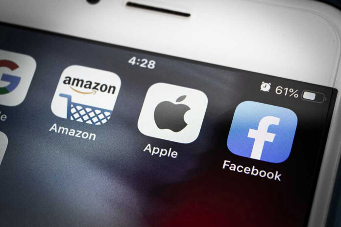 Amazon Apple Facebook apps on smartphone screen