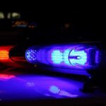 Car Stolen AT City Hall- Mayor Had Praised Defunding Police Close-up of police lights flashing in blue and red at night