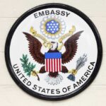 Missile Barrage Looms: U.S. Evacuates Embassy Seal of the United States Embassy featuring an eagle and the American flag