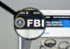 FBI Storms Hollywood Mansion – SNATCHES Iranian! FBI website shown through magnifying glass.