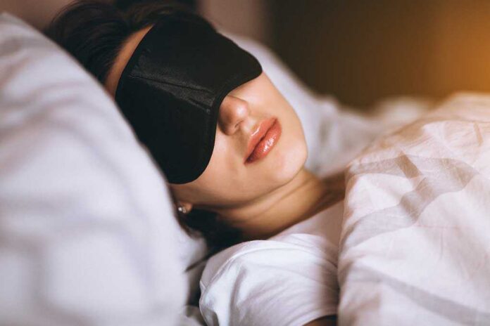 shutterstock_1057510142 (3).jpg A woman wearing a sleep mask, resting in bed