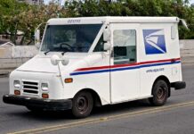 USPS COLLAPSE Imminent: $1 Stamps Coming White USPS delivery truck parked on a street