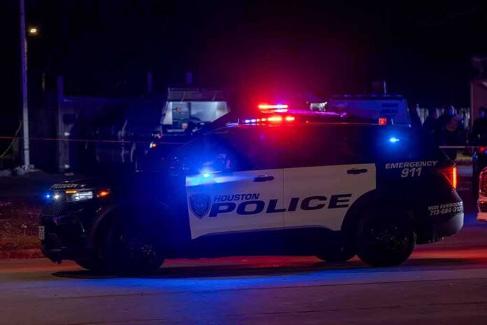 Houston police vehicle with emergency lights activated at night