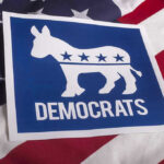 Democrat Pleads Guilty to Forging a Thousand Voter Registrations Democrats logo on American flag background