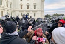 Protest Chaos Over Rumored FBI Director Hotel Stay A tense standoff between protesters and police at a demonstration