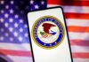 Governor’s Drug Scandal Shakes Mexico Department of Justice emblem displayed on a smartphone with an American flag background