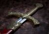 Close-up of an ornate decorative sword with a detailed hilt and blade