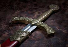 Hiker Makes Once In A Lifetime DISCOVERY! Close-up of an ornate decorative sword with a detailed hilt and blade