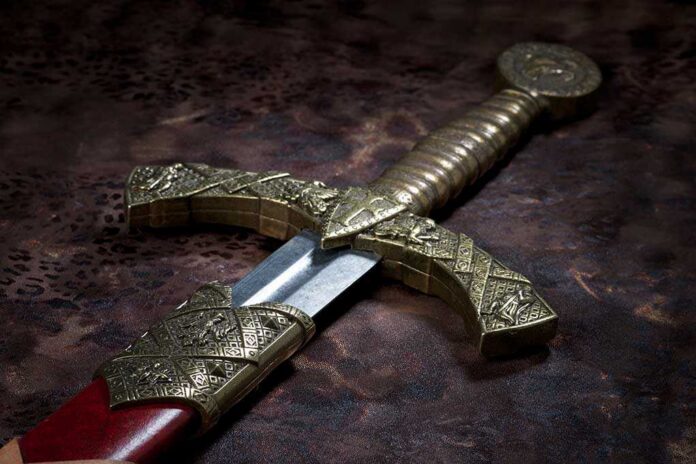 Close-up of an ornate decorative sword with a detailed hilt and blade