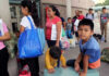85,000 Kids Vanish — Disturbing Audio! People waiting outside carrying bags, boys sitting and playing.