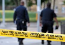 Neighbors DESPERATE Warnings Ignored – Three Dead! Police officers walking past caution tape at a crime scene