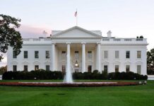 Mother’s Warning STOPS White House Terror Attack! The White House with a fountain in the foreground and an American flag flying