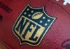 NFL Star Dead – Police Call It Homicide! Close-up of an NFL football with the logo prominently displayed