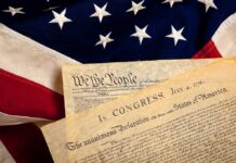 Joy Reid DISGRACES 4th of July! The Declaration of Independence laid on an American flag