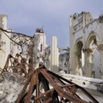 Historic Catholic Churches Set On Fire – France Burns! Interior view of a destroyed building with collapsed arches and debris