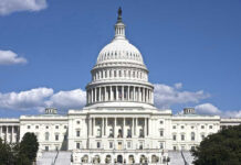 Vicious BRAWL Breaks Out On Congress Floor! U.S. Capitol building against blue sky.