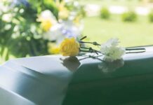Beloved Hollywood Star Gone At 36 Yellow rose and white carnation on a green casket