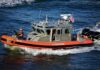 U.S. Coast Guard patrol boat speeding on open water