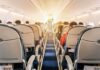 Laptop Ignites Mid-Flight — Chaos Aboard airplane cabin with passengers seated in economy class