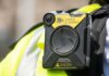 Body-worn camera attached to a high-visibility vest