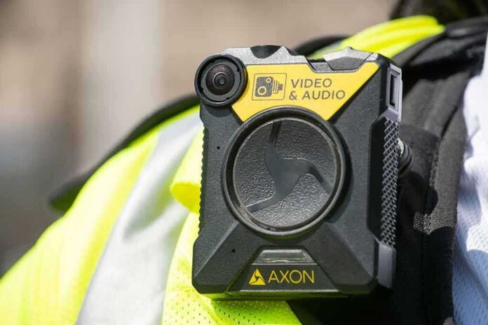 Body-worn camera attached to a high-visibility vest